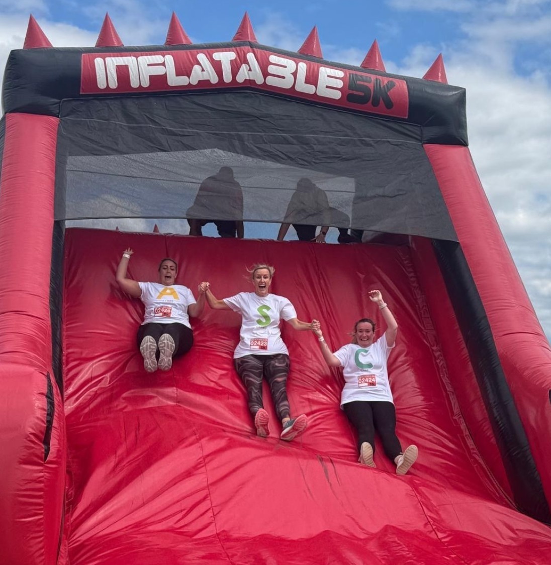 Pennine Care Charity fundraisers inflatable slide.jpg