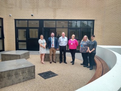 Pennine Care staff in the garden area of the new PICU